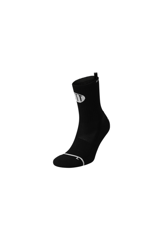 Black anti-slip grip socks by TRINITY, featuring a sleek design with dotted grip patterns for enhanced stability and comfort, perfect for various sports like running, football, padel, pilates and gym workouts."