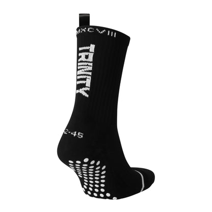 Black anti-slip grip socks by TRINITY, featuring a sleek design with dotted grip patterns for enhanced stability and comfort, perfect for various sports like running, football, padel, pilates and gym workouts.