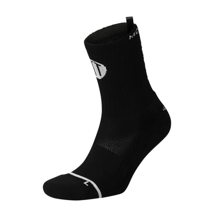 Black anti-slip grip socks by TRINITY, featuring a sleek design with dotted grip patterns for enhanced stability and comfort, perfect for various sports like running, football, padel, pilates and gym workouts.