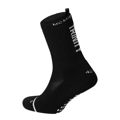 Black anti-slip grip socks by TRINITY, featuring a sleek design with dotted grip patterns for enhanced stability and comfort, perfect for various sports like running, football, padel, pilates and gym workouts.
