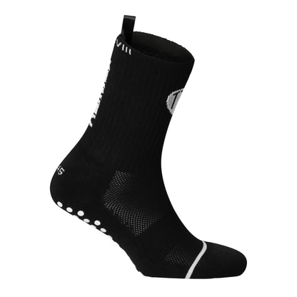 Black anti-slip grip socks by TRINITY, featuring a sleek design with dotted grip patterns for enhanced stability and comfort, perfect for various sports like running, football, padel, pilates and gym workouts.