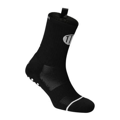 Black anti-slip grip socks by TRINITY, featuring a sleek design with dotted grip patterns for enhanced stability and comfort, perfect for various sports like running, football, padel, pilates and gym workouts.