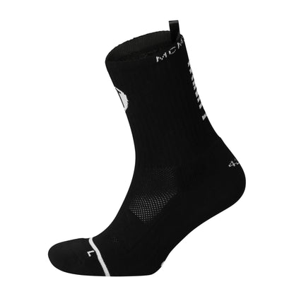 Black anti-slip grip socks by TRINITY, featuring a sleek design with dotted grip patterns for enhanced stability and comfort, perfect for various sports like running, football, padel, pilates and gym workouts.
