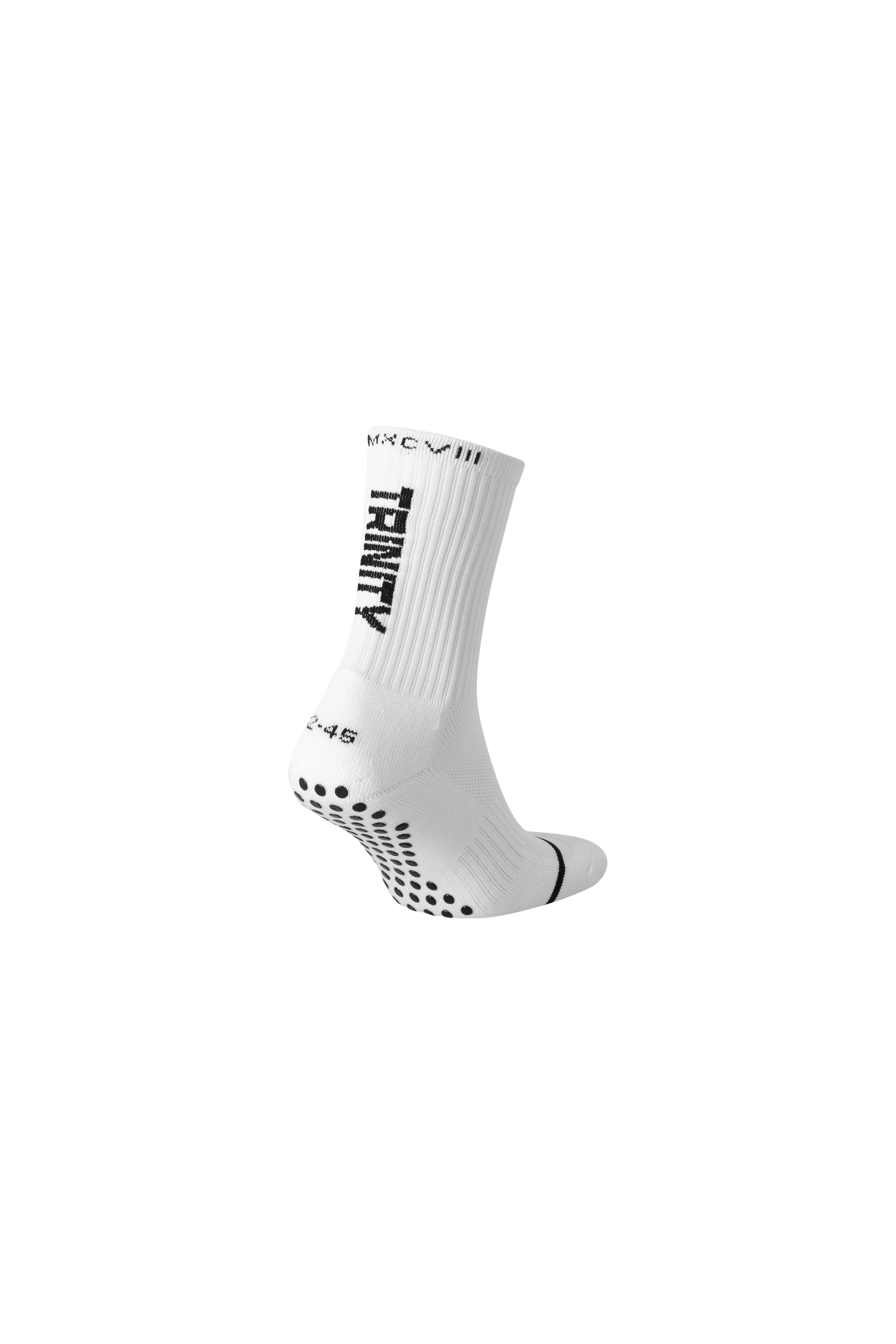 White anti-slip grip socks by TRINITY, featuring a sleek design with dotted grip patterns for enhanced stability and comfort, perfect for various sports like running, football, padel, pilates and gym workouts.