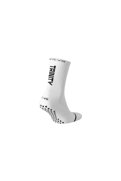 White anti-slip grip socks by TRINITY, featuring a sleek design with dotted grip patterns for enhanced stability and comfort, perfect for various sports like running, football, padel, pilates and gym workouts.